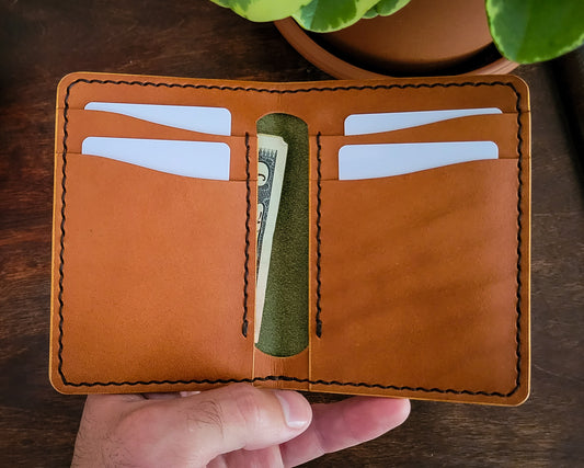 Green and tan vertical bifold card wallet with cash pockets